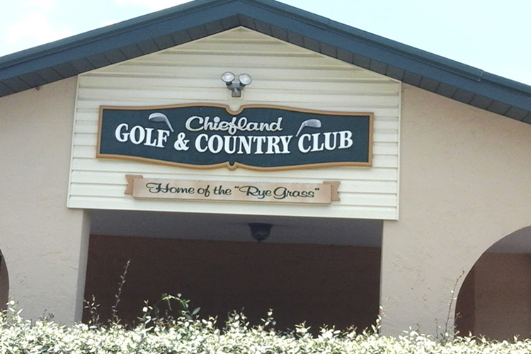 Clubhouse facade and welcome sign